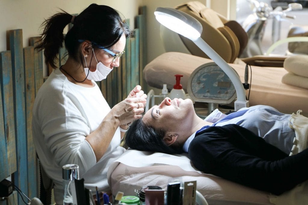woman receiving facial spa