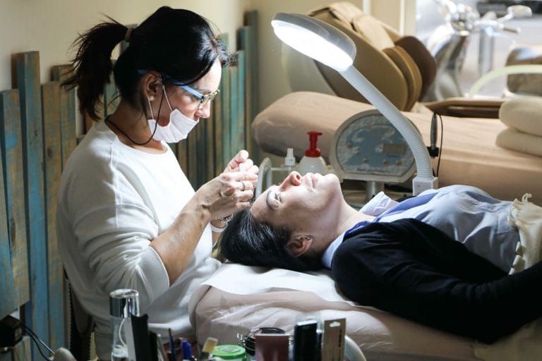 woman receiving facial spa