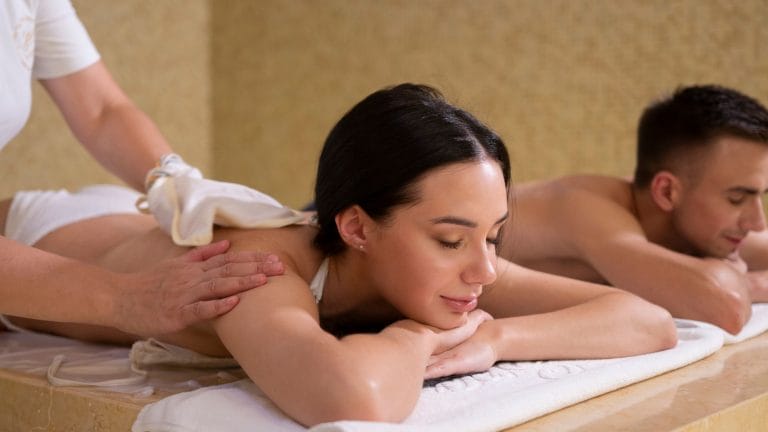 couple relaxing spa massage table