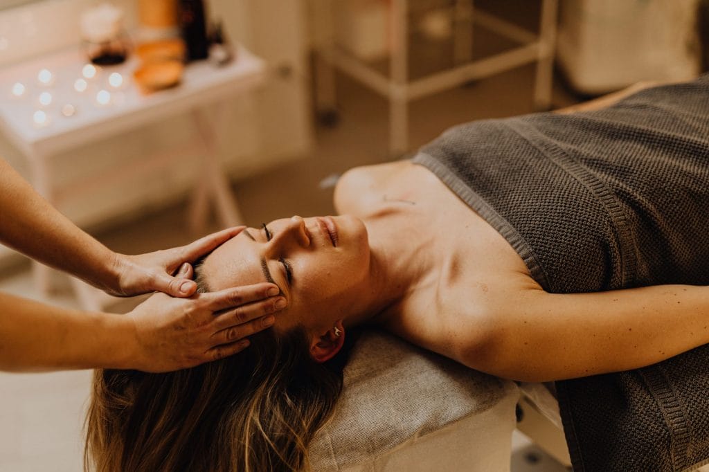 woman receiving massage spa
