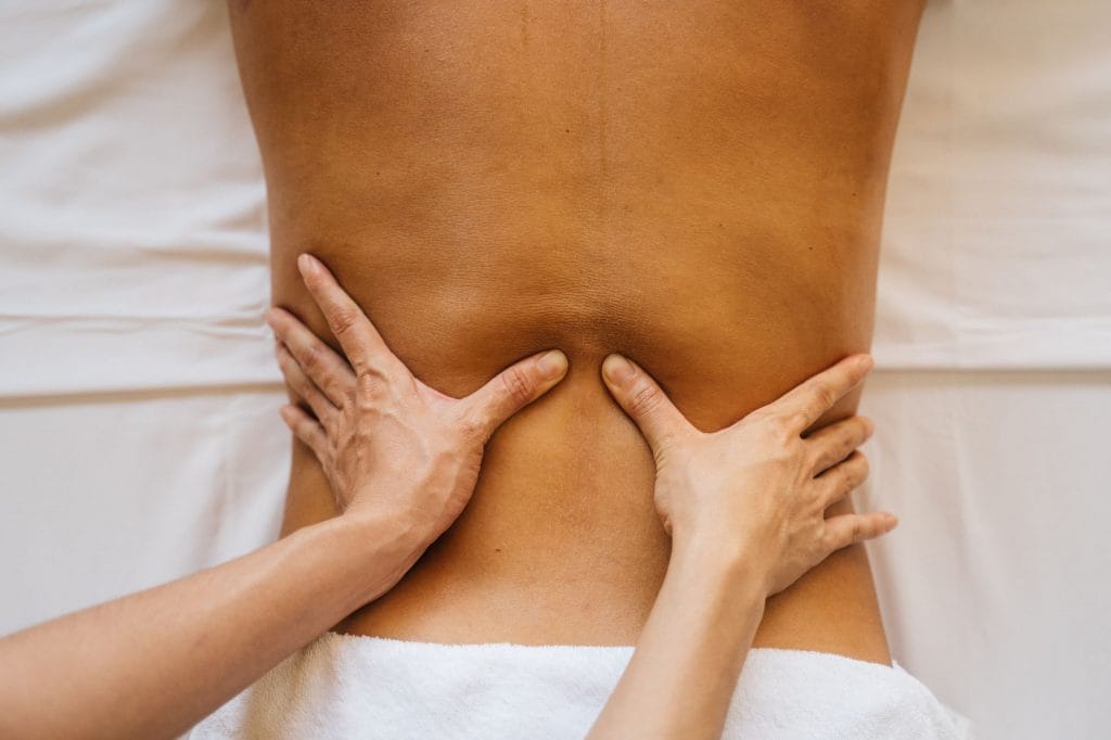 massage therapist hands back spa